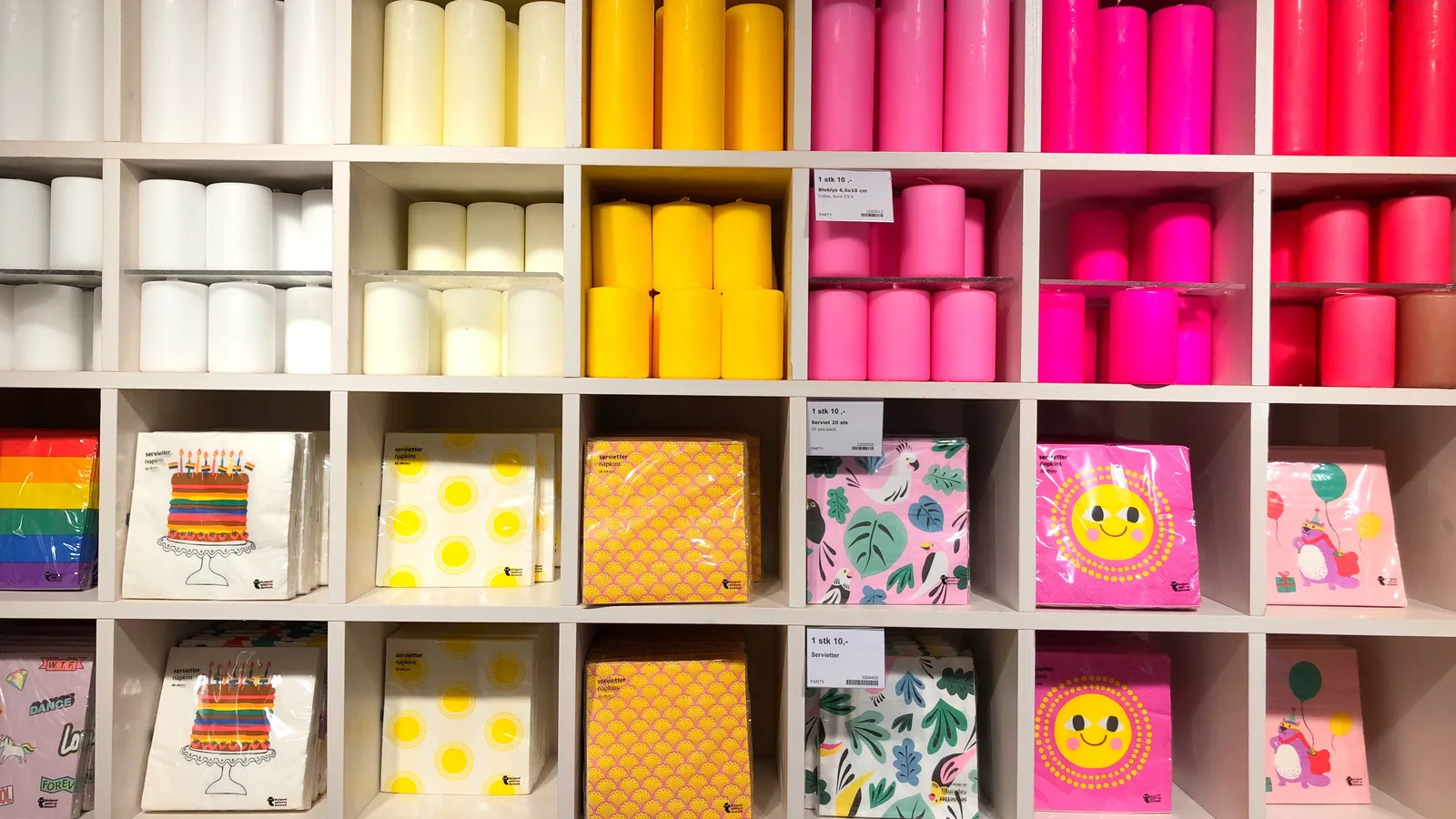 Party goods stacked on the shelves of a brightly lit store